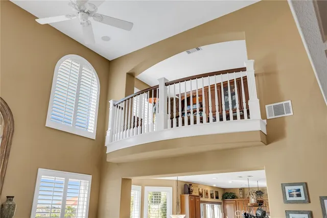 a room with pool table and paintings on the wall