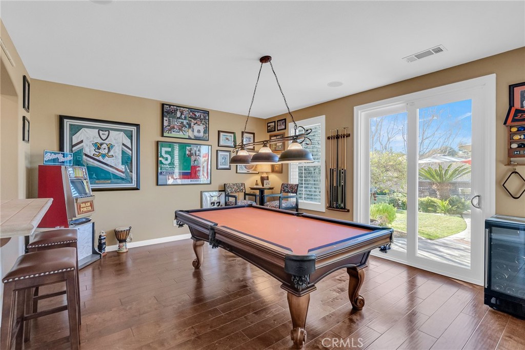14143 Ashton Lane Riverside, CA 92508 - Photo 17 of 40 a room with pool table and paintings on the wall