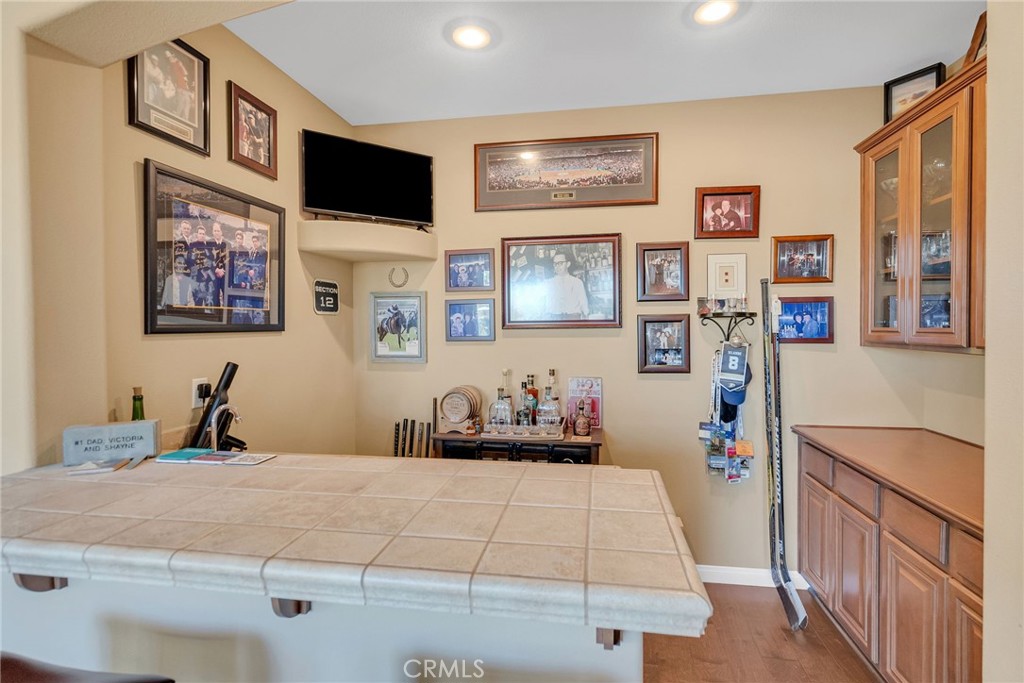 14143 Ashton Lane Riverside, CA 92508 - Photo 19 of 40 a bedroom with a bed and a flat screen tv