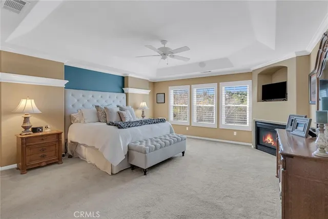 a bedroom with a bed and a lamp