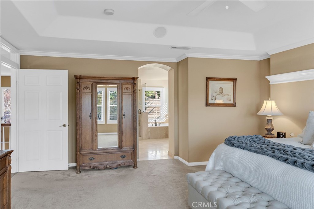 14143 Ashton Lane Riverside, CA 92508 - Photo 22 of 40 a bedroom with a bed and a lamp