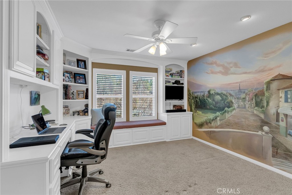 14143 Ashton Lane Riverside, CA 92508 - Photo 28 of 40 a view of a workspace with furniture and a window