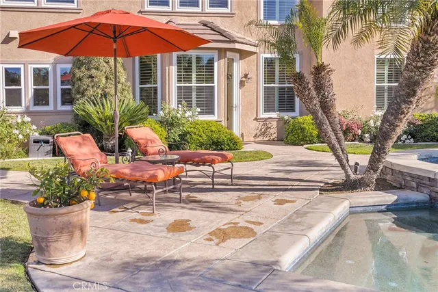 a view of an outdoor sitting area with furniture