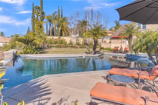 a view of a backyard with sitting area