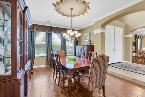 a view of a dining room with furniture and window