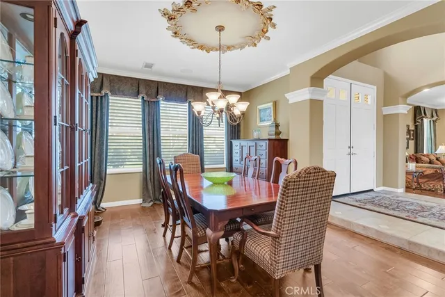 a view of a dining room with furniture and window