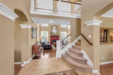 a view of entryway and hall with a living room