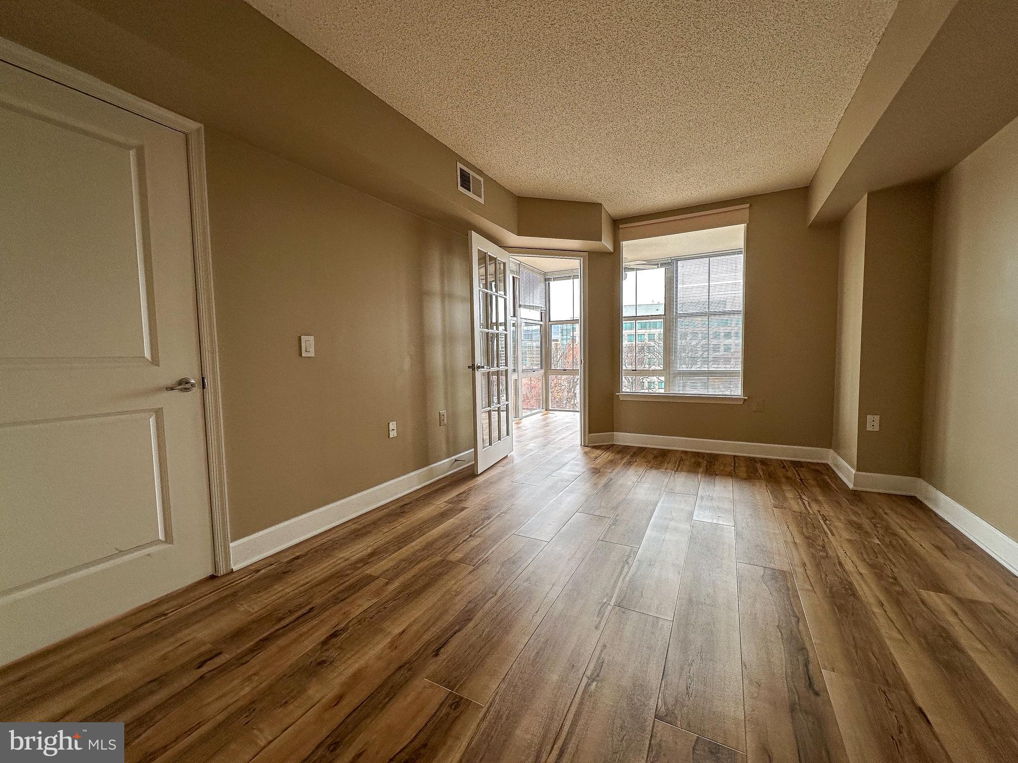 11800 Sunset Hills Road, Unit 1111 Reston, VA 20190 - Photo 12 of 66 Master bedroom 1 leads to sun room