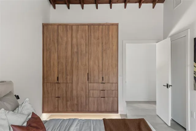 a bedroom with a bed and a walk in closet