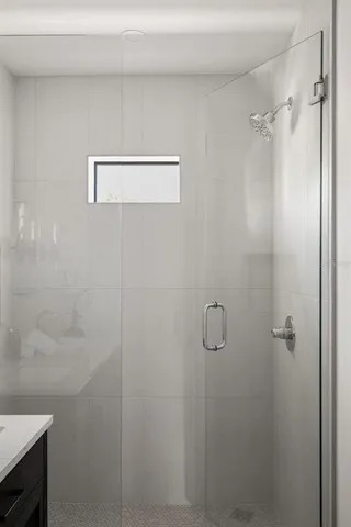 a bathroom with a double vanity sink and mirror