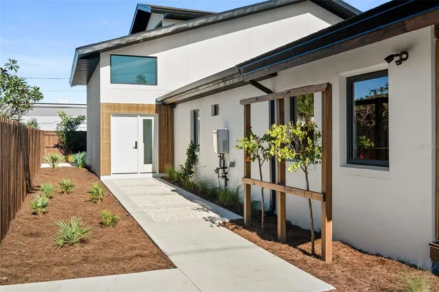 a view of a livingroom with furniture and windows