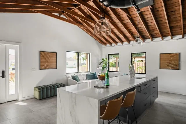 a kitchen with a sink and chandelier
