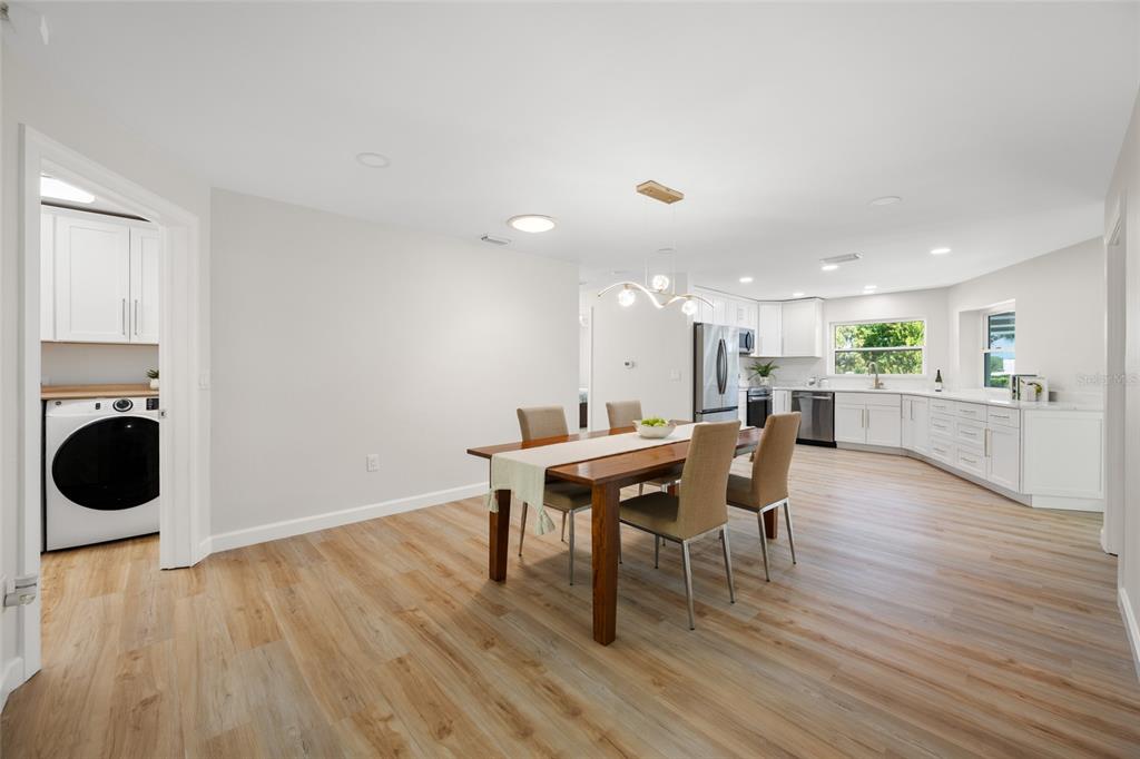 656 Mehlenbacher Road Belleair, FL 33756 - Photo 6 of 49 a dining room with furniture and wooden floor