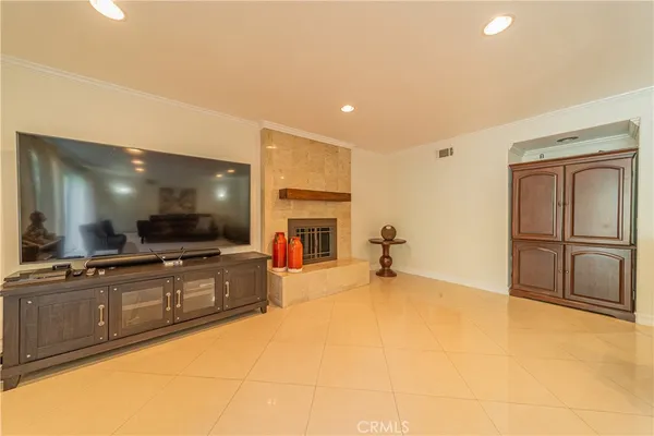 a view of a kitchen with a sink and a refrigerator