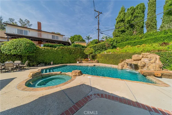 a view of a swimming pool with a patio