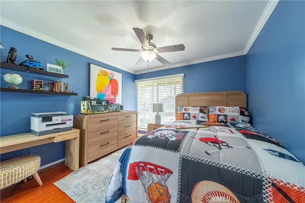 a bed room with a bed and a desk