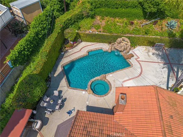 a backyard of a house with garden and patio