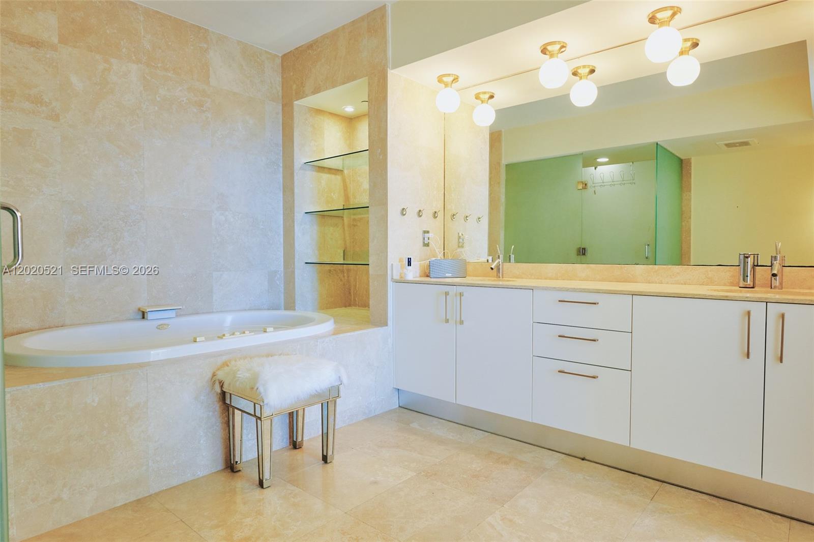 450 Alton Road, Unit 2810 Miami Beach, FL 33139 - Photo 13 of 29 a bathroom with a sink and a mirror