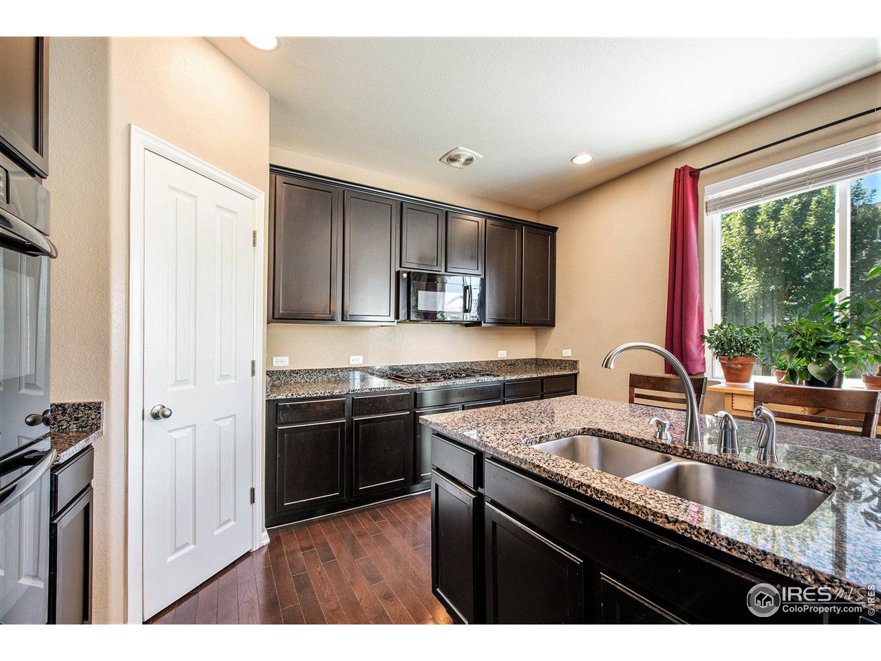 4872 Monarch Drive Firestone, CO 80504 - Photo 11 of 34 Gourmet Kitchen with Gas Range and Double Electric Ovens.