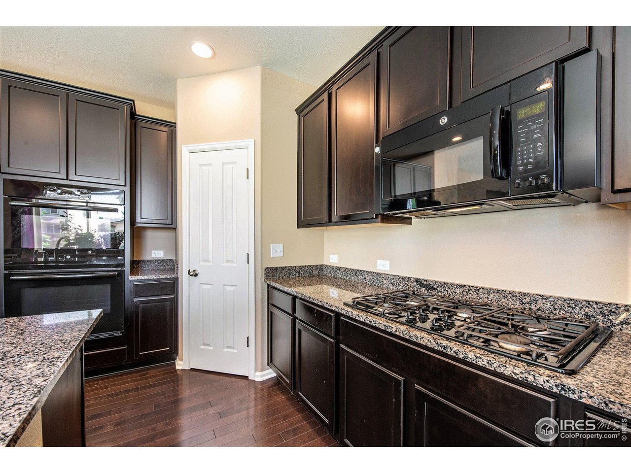 4872 Monarch Drive Firestone, CO 80504 - Photo 13 of 34 Gourmet Kitchen with Gas Range and Double Electric Ovens.