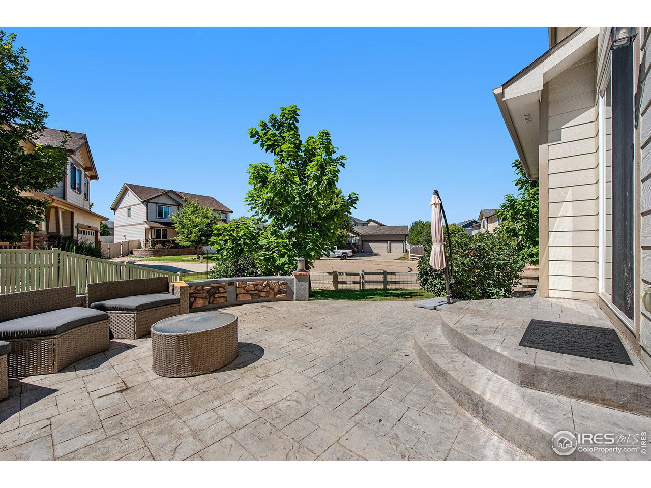 4872 Monarch Drive Firestone, CO 80504 - Photo 28 of 34 Stamped Concrete Patio - South Side of the Home