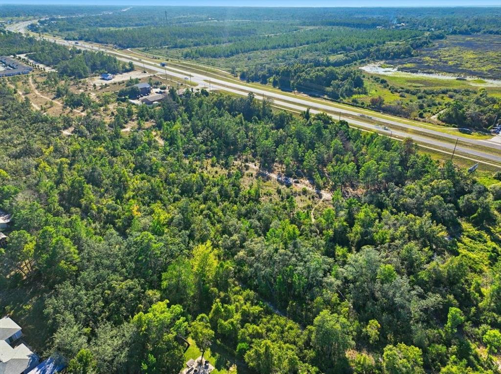 7124 Commercial Way Weeki Wachee, FL 34613 - Photo 20 of 30 a view of a field with an ocean view