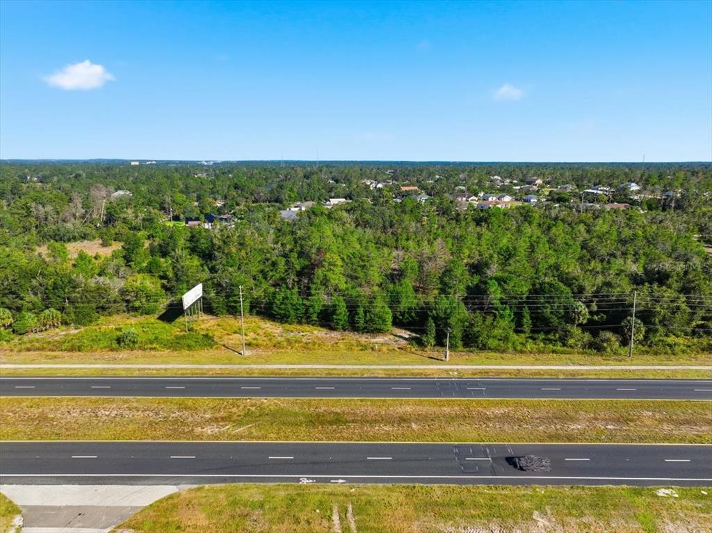 7124 Commercial Way Weeki Wachee, FL 34613 - Photo 28 of 30 a view of a swimming pool and an outdoor space