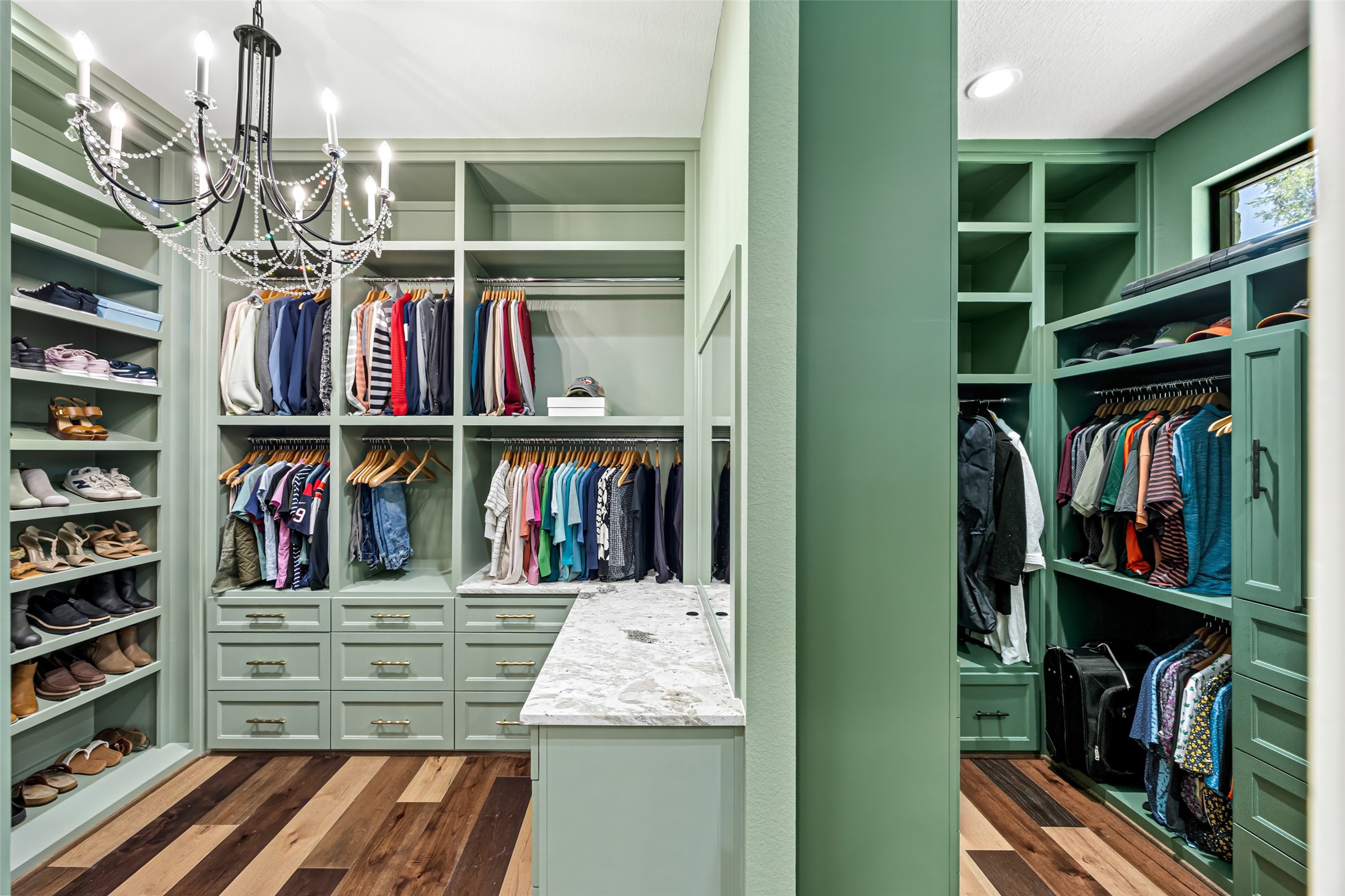 19314 Chateau Ridge Court Tomball, TX 77377 - Photo 18 of 50 Expansive built-in walk-in closet with custom cabinetry, elegant lighting, and boutique-style organization