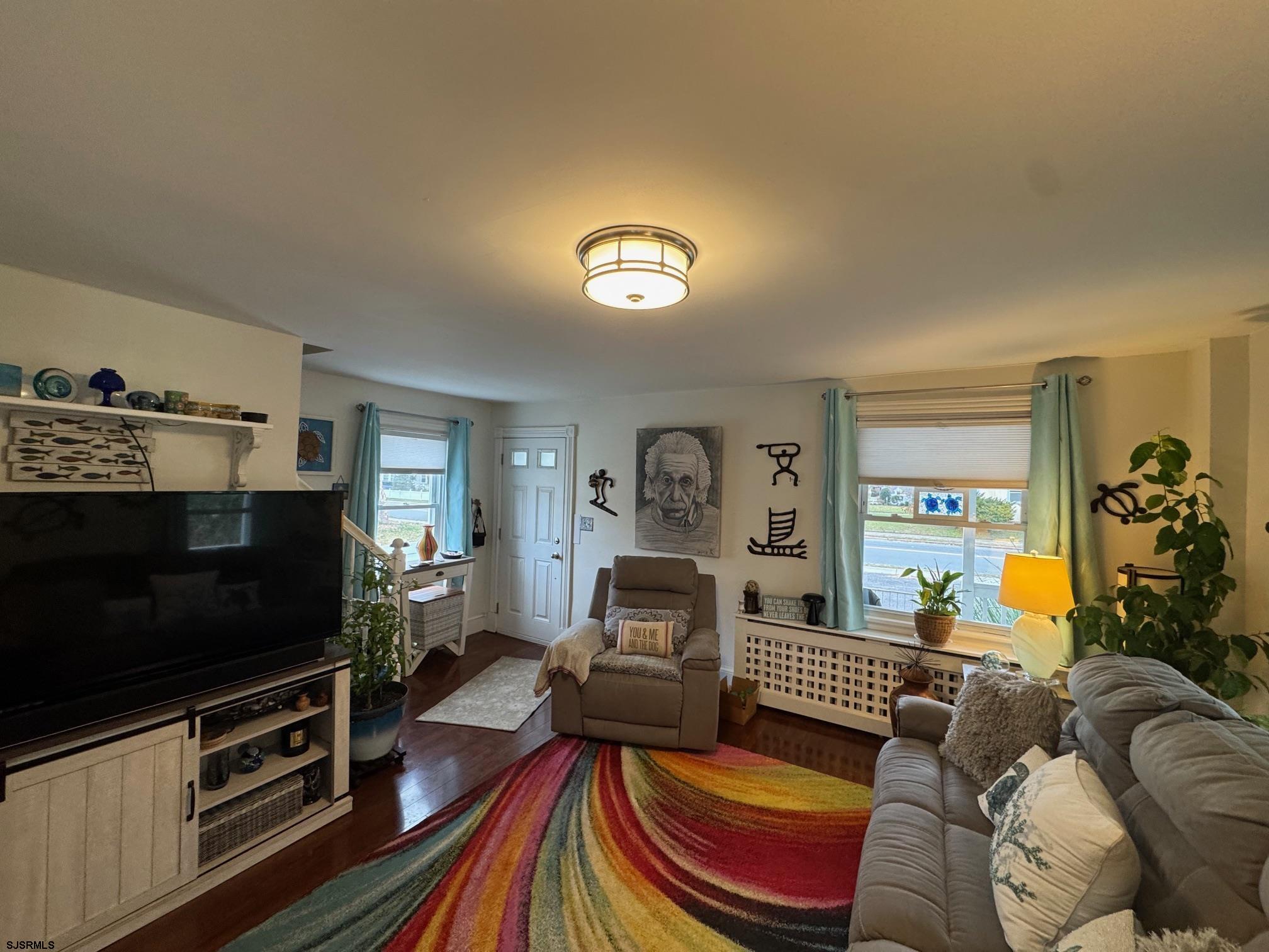 1801 Tilton Road Northfield, NJ 08225 - Photo 11 of 30 a bedroom with furniture and a flat screen tv