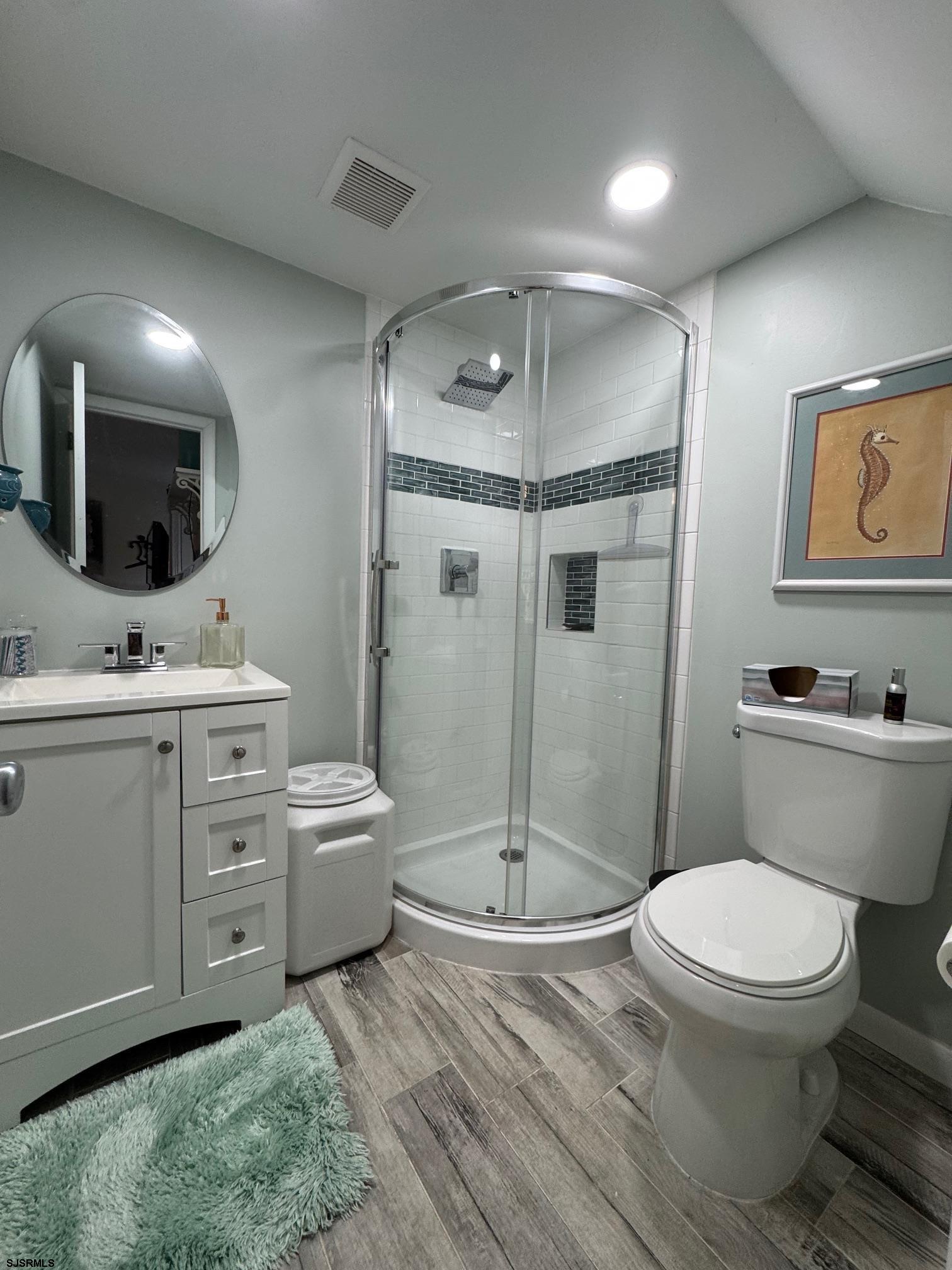 1801 Tilton Road Northfield, NJ 08225 - Photo 13 of 30 a bathroom with a toilet sink and shower