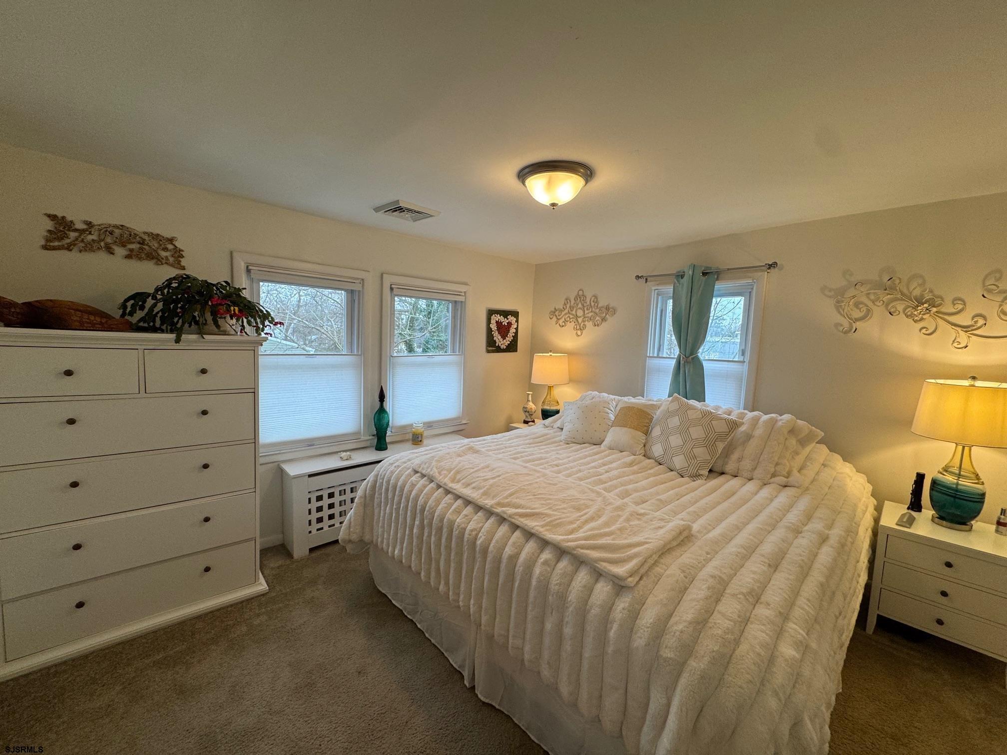 1801 Tilton Road Northfield, NJ 08225 - Photo 16 of 30 a bedroom with a bed and a dresser in it