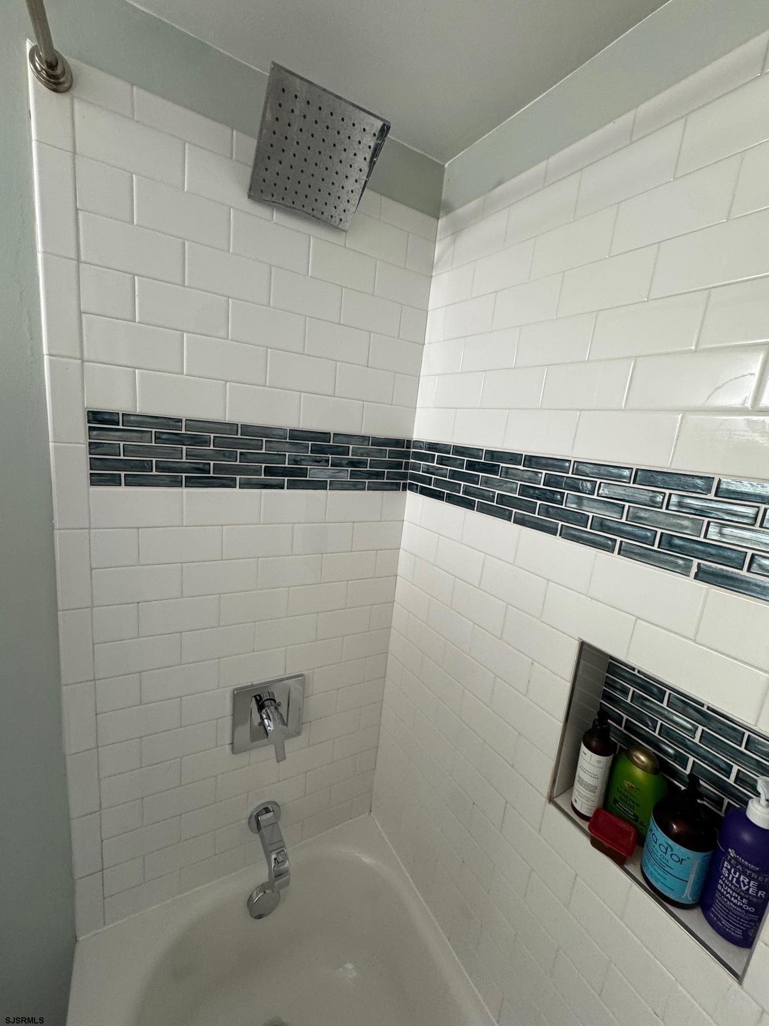 1801 Tilton Road Northfield, NJ 08225 - Photo 21 of 30 a bathroom with a shower and a bathtub