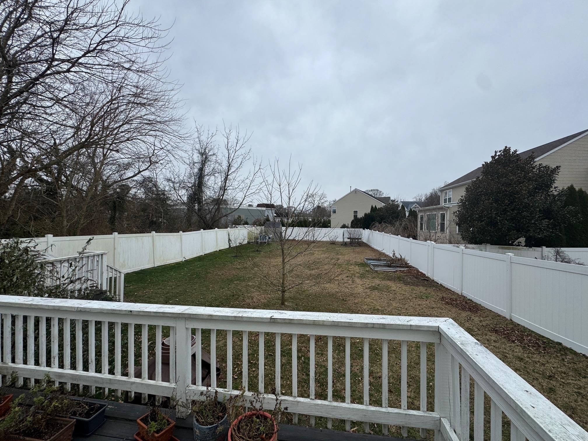 1801 Tilton Road Northfield, NJ 08225 - Photo 25 of 30 a view of a balcony with wooden floor and fence