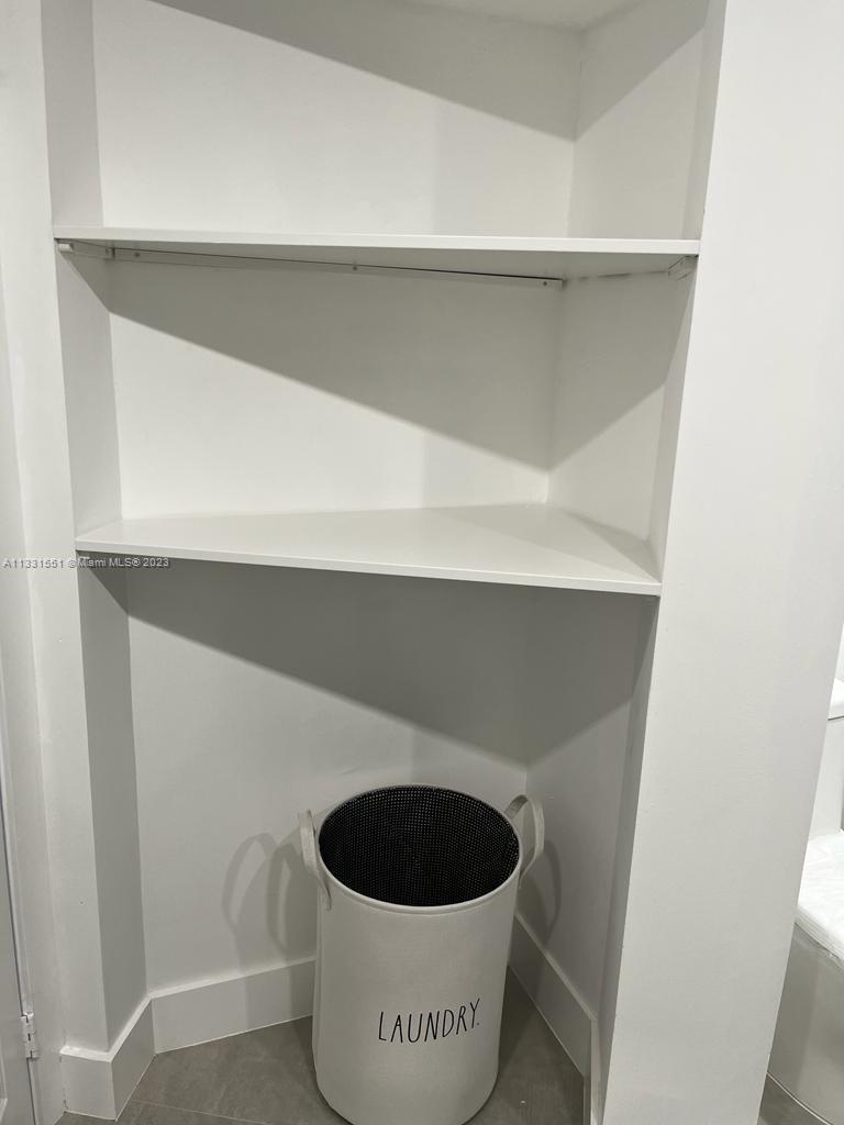 3530 Mystic Pointe Drive, Unit PH08 Aventura, FL 33180 - Photo 5 of 11 a close view of a potted plant on a shelf