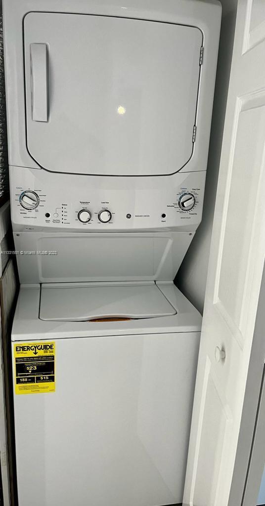 3530 Mystic Pointe Drive, Unit PH08 Aventura, FL 33180 - Photo 7 of 11 a close up view of washer and dryer