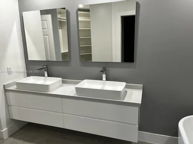 a white bath tub sitting in a bathroom