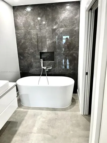 a bathroom with a sink and a shower