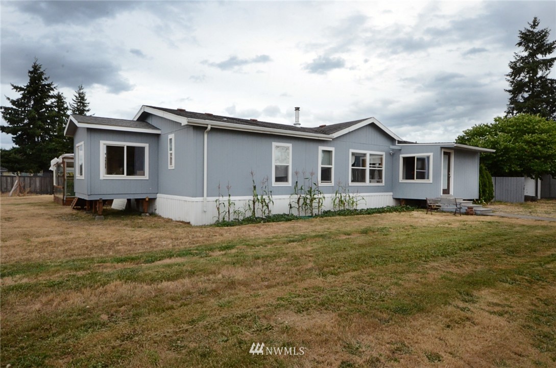 18224 Pendleton Street Southwest Rochester, WA 98579 - Photo 1 of 35 a front view of a house with a garden