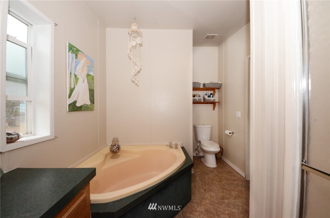 18224 Pendleton Street Southwest Rochester, WA 98579 - Photo 13 of 35 a bathroom with a sink and toilet