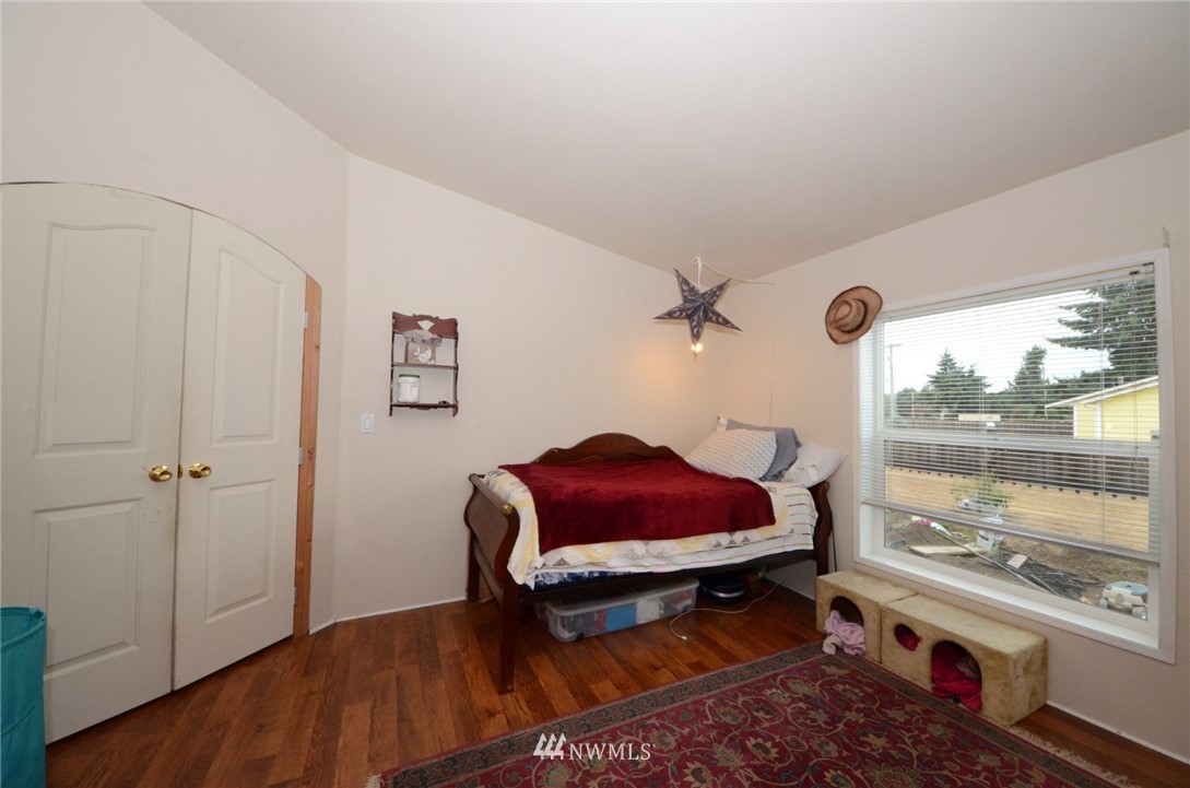 18224 Pendleton Street Southwest Rochester, WA 98579 - Photo 17 of 35 a very nice looking room with a big bed and a wooden floor