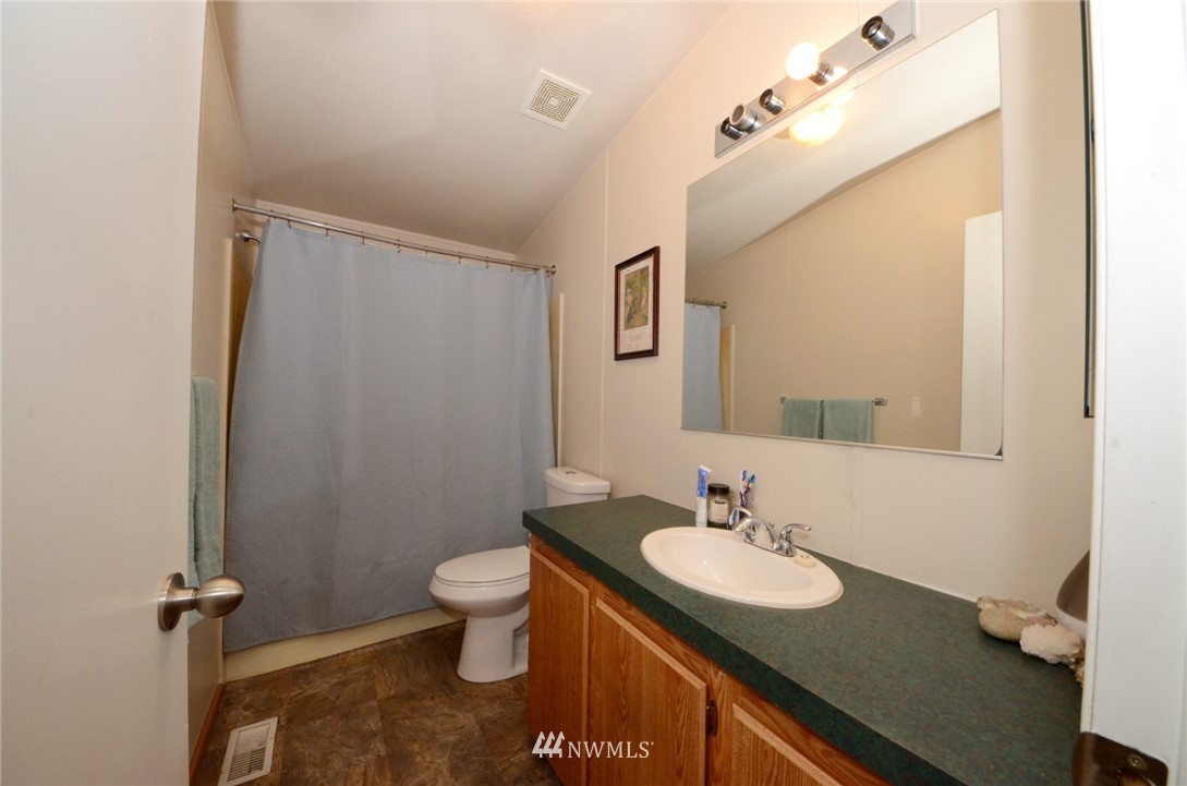 18224 Pendleton Street Southwest Rochester, WA 98579 - Photo 18 of 35 a bathroom with a sink and a mirror