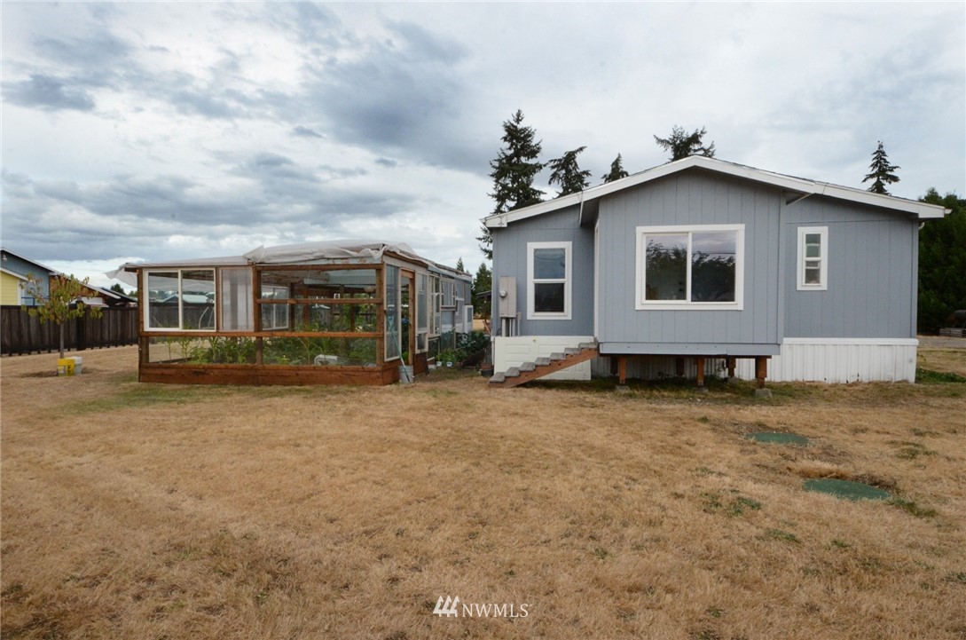 18224 Pendleton Street Southwest Rochester, WA 98579 - Photo 3 of 35 a front view of a house with a garden