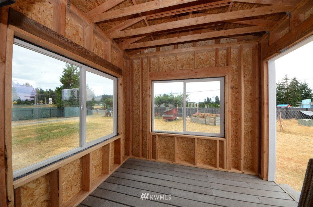 18224 Pendleton Street Southwest Rochester, WA 98579 - Photo 21 of 35 a view of a room with wooden floor and windows