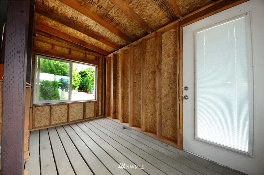 18224 Pendleton Street Southwest Rochester, WA 98579 - Photo 22 of 35 a view of a room with wooden floor and balcony
