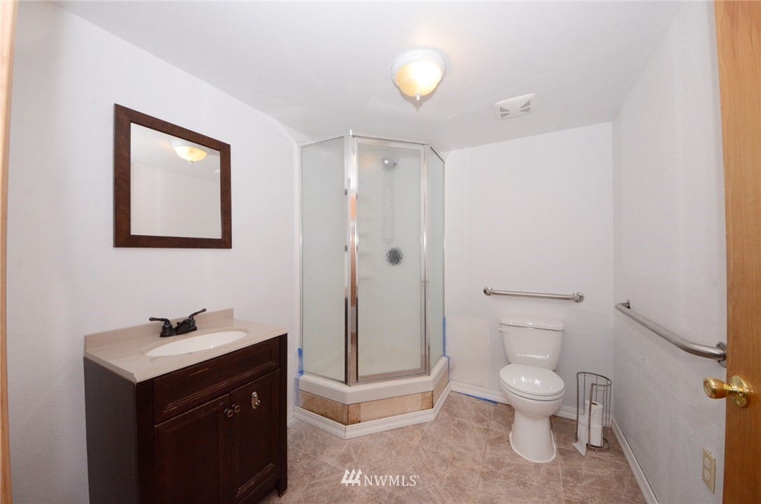 18224 Pendleton Street Southwest Rochester, WA 98579 - Photo 28 of 35 a white toilet sitting next to a bathroom sink