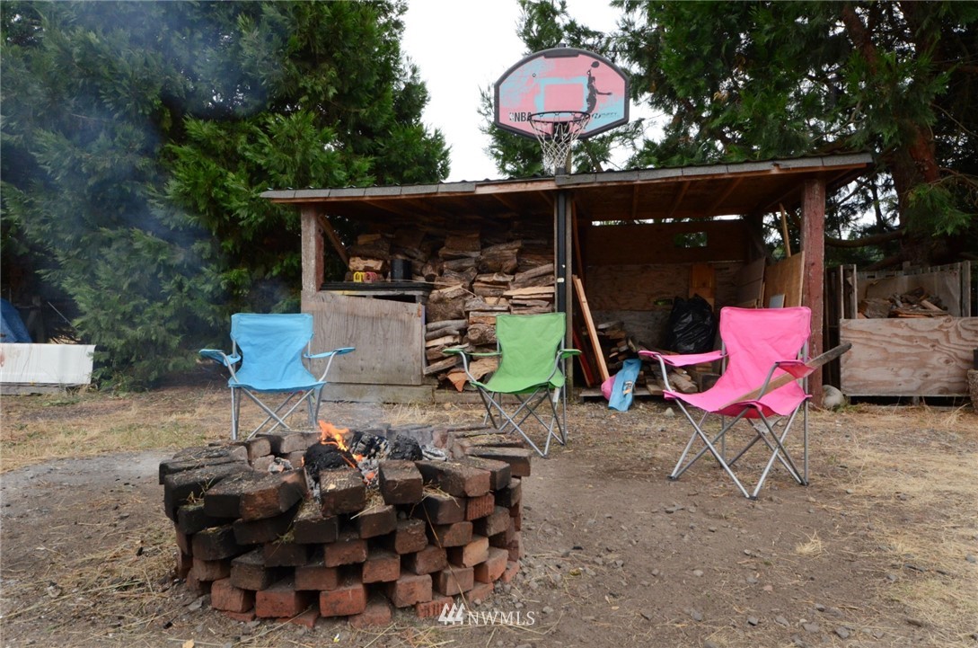 18224 Pendleton Street Southwest Rochester, WA 98579 - Photo 29 of 35 a view of outdoor sitting area with furniture and wooden floor
