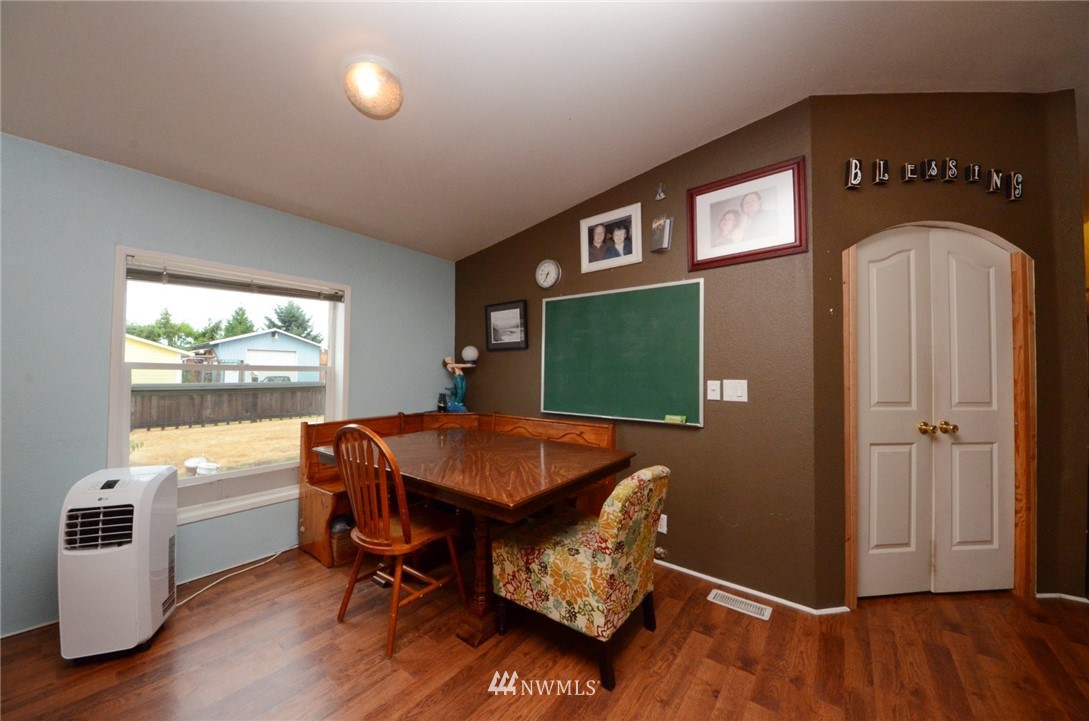 18224 Pendleton Street Southwest Rochester, WA 98579 - Photo 6 of 35 a view of a dining room with furniture window and wooden floor