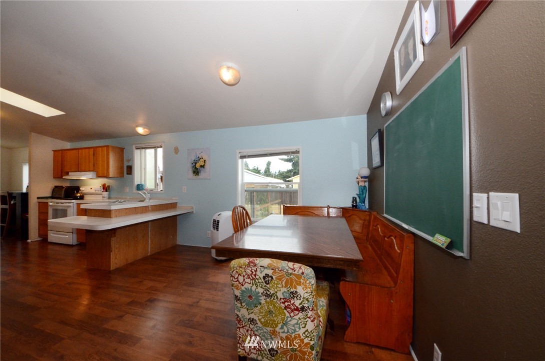18224 Pendleton Street Southwest Rochester, WA 98579 - Photo 7 of 35 a room with wooden floor and furniture