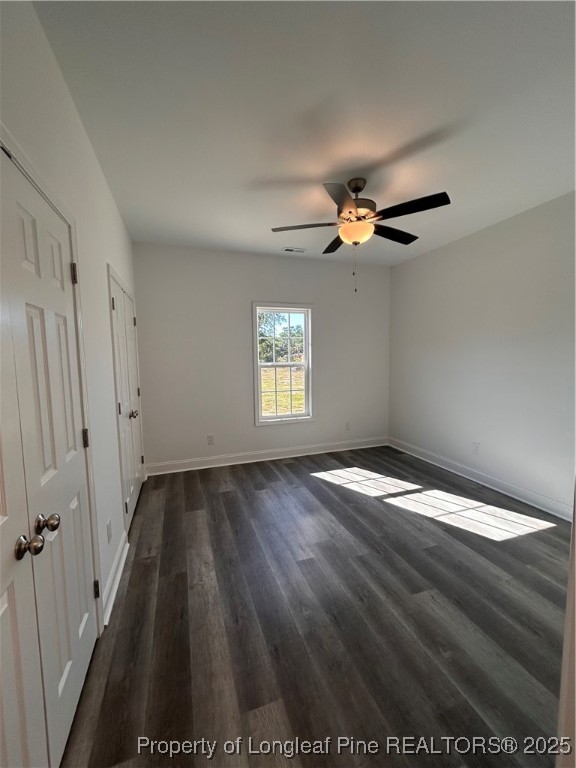 407 Morehead Street Spring Lake, NC 28390 - Photo 7 of 12 wooden floor in an empty room with a window