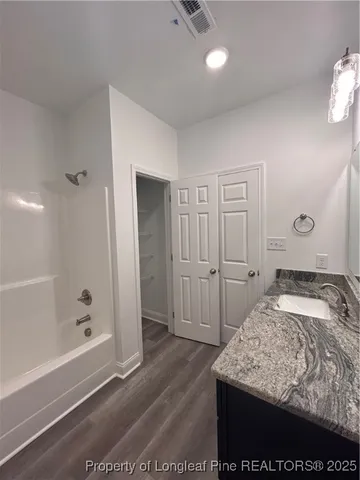 a bedroom with a bed and a shower